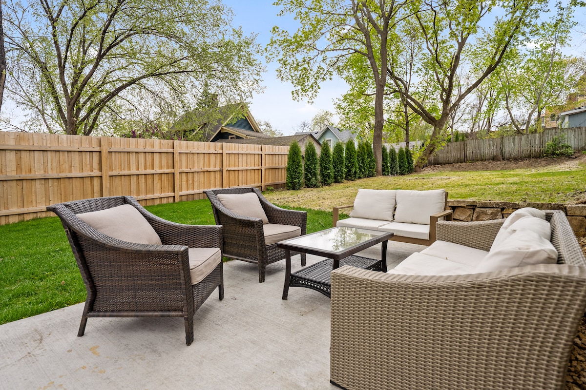 The Backyard — patio, fire pit, and open lawn